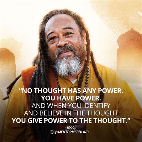 A Man With Dreadlocks Standing In Front Of A Quote From Mooji