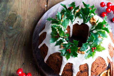 Bookmark this recipe to use as a thanksgiving or christmas dessert. Christmas homebaked dark chocolate bundt cake decorated with white icing and holly berry ...