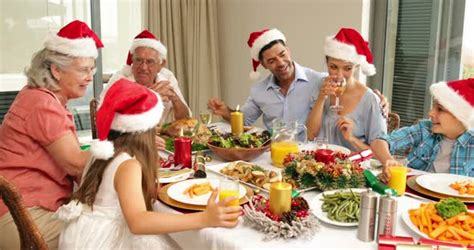 This link is to an external site that may or may not meet accessibility guidelines. Happy extended family at the christmas dinner table by Wavebreakmedia
