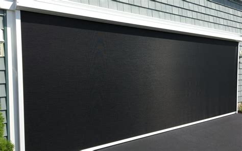 Upgrade Your Space With A Motorized Garage Door Screen — Sunsetter