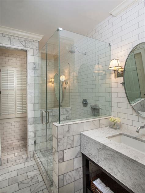 The shower tiles and floor match the rest of the bathroom which in combination with the glass dividers allow to blend in seamlessly. Tile Bathroom Wall | Houzz