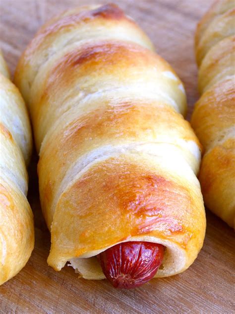 Pretzel pigs in a blanket or pretzel hot dogs served with bavarian grainy mustard. Homemade Pretzel Dogs | A Homemade Living