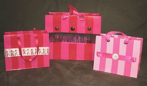 Make cute gift bags out of Victoria's Secret shopping bags. Using