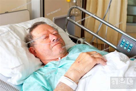 Portrait Of Sick Old Man In Hospital Bed Stock Photo Picture And Low