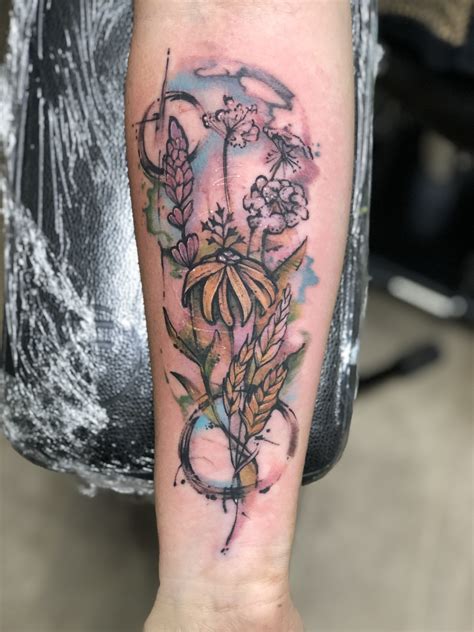 Watercolor wildflower tattoo | Wildflower tattoo, Tattoos, Small tattoos