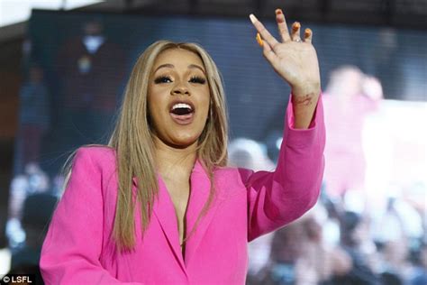 Braless Cardi B Almost Spills Out Of Her Hot Pink Blazer Daily Mail
