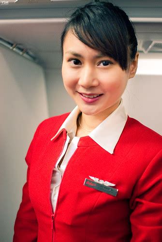 Air asia stewardesses pose sexily in their uniforms, which have been deemed too revealing by one offended passengercredit: Mildred Patricia Baena: air asia stewardess uniform