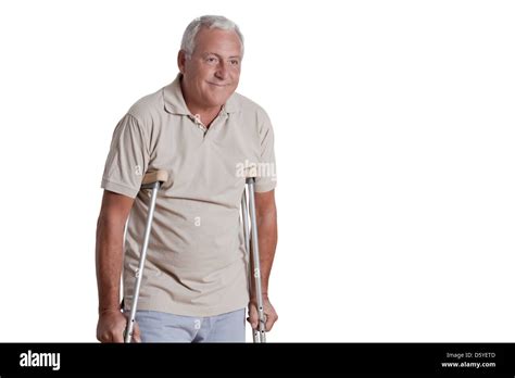 Senior Man With Crutches Stock Photo Alamy