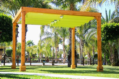 Designer jamie durie filled triangles where wood pieces met with blue and yellow fabric, leaving lots of negative space to allow some light to get through. Retractable Shade Canopy Pergola Kit, Custom Made from Redwood