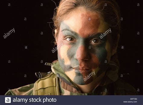 Maybe you would like to learn more about one of these? Close up of female soldier with camouflage face paint on ...