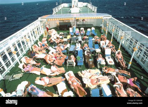 Cruise Ship Passengers Use Upper Deck For Sunbathing Stock Photo Alamy