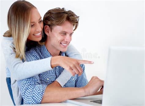Shopping For Their Perfect Home A Young Woman Embracing Her Boyfriend
