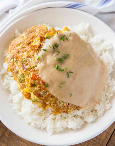 Egg foo yung, commonly called a chinese recipe, is actually a cultural hybrid of a dish. Egg Foo Young is a Chinese egg omelette dish made with ...