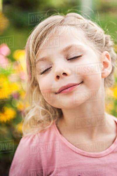 Close Up Portrait Of Young Girl With Eyes Closed Stock Photo Dissolve