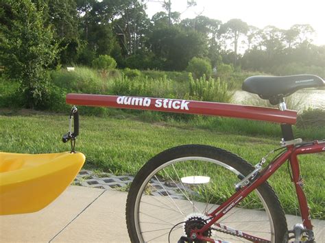 Just wanted to add another in the category of a frame with wheels strapped to one part of the boat, and a hitch strapped to the bow. www.dumb-stick.com bicycle tow bar for towing your kayak ...