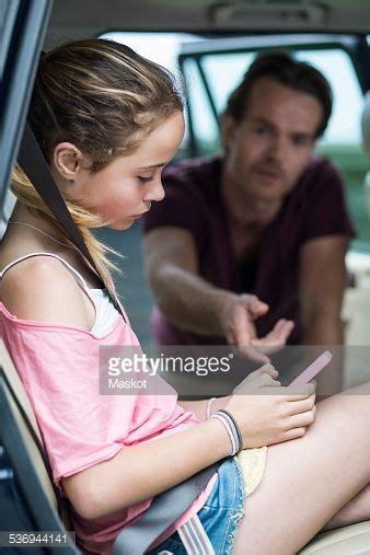 Stock Photo Babe Ignoring Father While Using Mobile Phone In Car Parenting Tweens