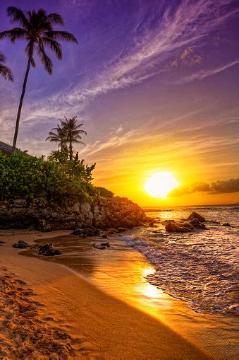 A Tropical Beach Sunset On A Beautiful Day Stock Photo