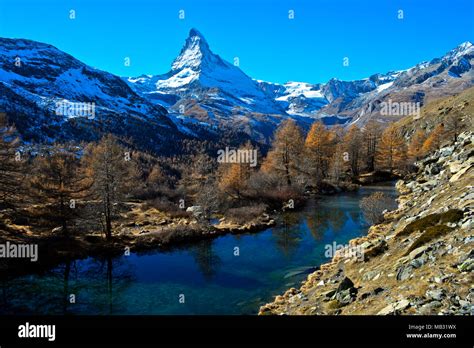 Lake Grindjesee In Autumn With View Of The Snow Covered Matterhorn