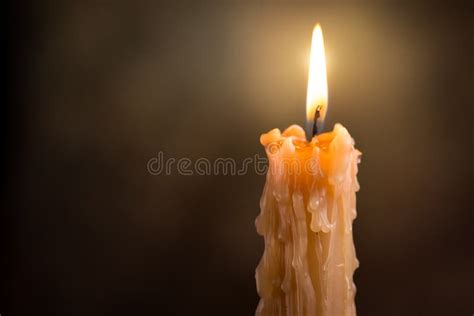 Candle Flame Close Up On A Dark Background Melted Wax Candle Light