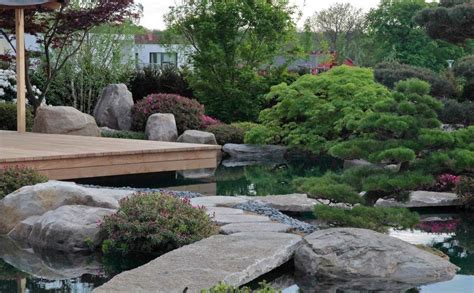 Japanese garden design guide create the perfect zen ninja ltd. Modern japanese garden with natural swimming pool and traditional Teahouse | Modern landscaping ...