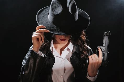 Premium Photo Silhouette Of A Female Detective In A Coat And Hat With