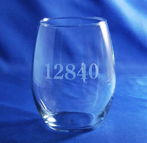A Wine Glass With The Date Engraved On It