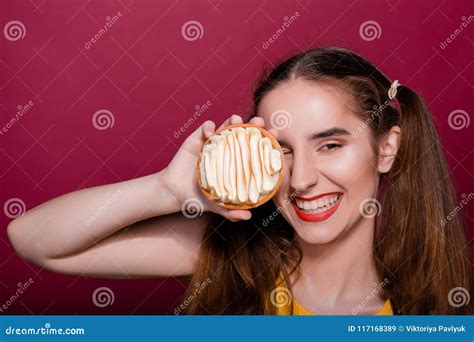 Pleased Brunette Young Woman With Red Lips Having Fun With Caramel Tart Cake Empty Space Stock