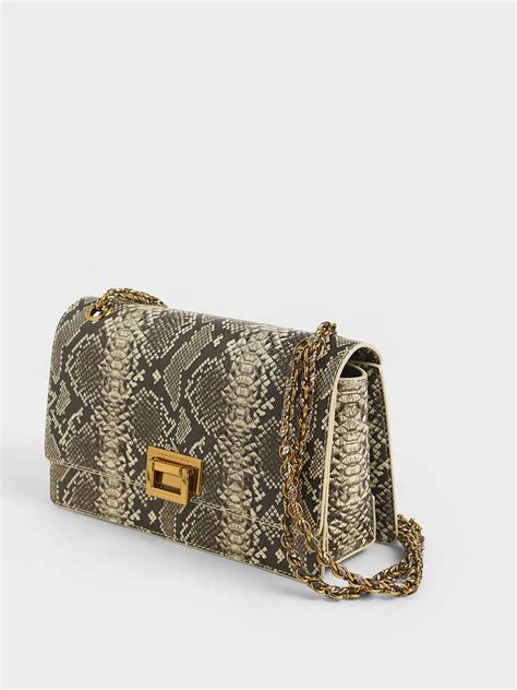 The official charles & keith facebook page. Multicoloured Snake Print Chain Strap Shoulder Bag ...