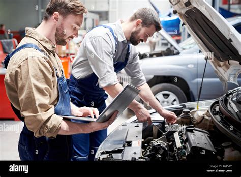Mechanics Working In Car Service Stock Photo Alamy