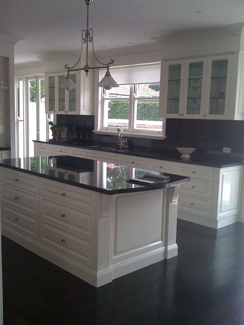 Kitchen with black cabinets kitchen with black cabinets this beautiful kitchen is finished with white subway tile black cabinets and a warm kitchen island with chevron woodwork. Gallery | Kitchen design, Kitchen renovation, White kitchen design