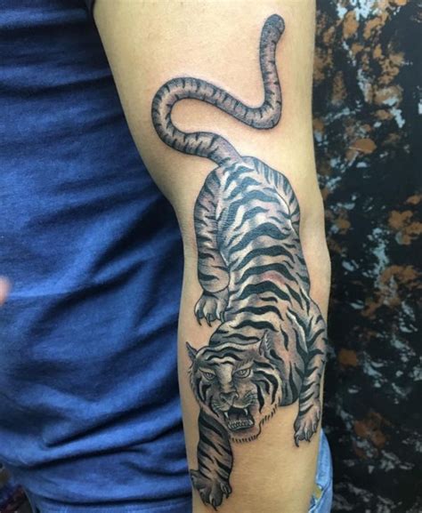 That is why if you are into dog tattoo designs, then maybe going for this type of tattoo will not work for you.we are sure in the vast world of tattoos; Tiger Tattoo - Its That means and 30 Nice Design Concepts ...