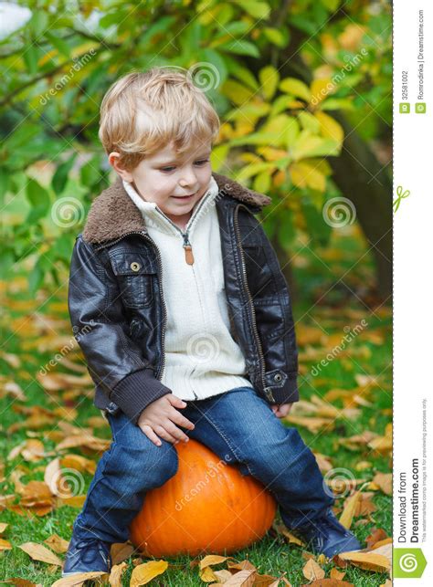 Little Toddler With Big Orange Pumpkin In Garden Stock Photo Image Of