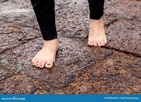 Woman Bare Feet Walking On Wet Rocky Pavement Stock Image Image Of