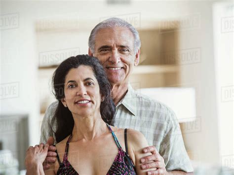 Portrait of smiling older couple - Stock Photo - Dissolve