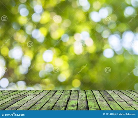 Wooden Floor And Green Forest Bokeh Blur Background Stock Photo Image