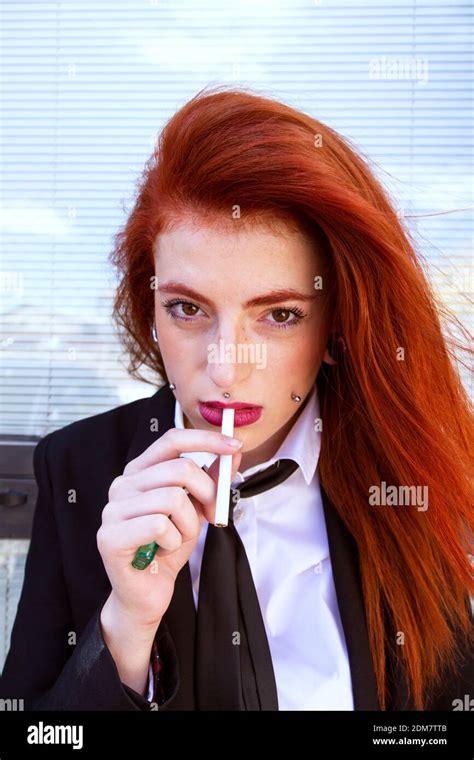 Portrait Of Businesswoman Smoking Cigarette Stock Photo Alamy