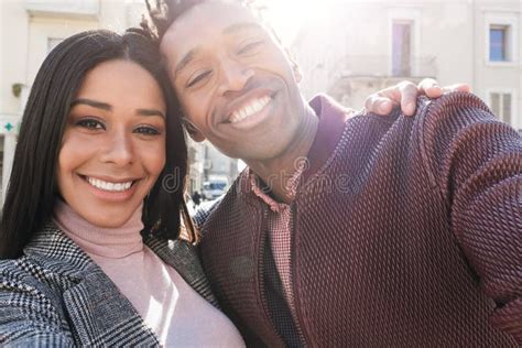 African Young Couple Having Fun Doing Selfie Outdoor In The City