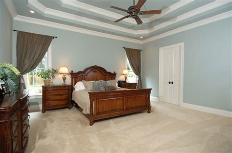 Add a fresh liner to the paint tray and then pour paint into the tray. Three Tiered Ceiling in Bedroom