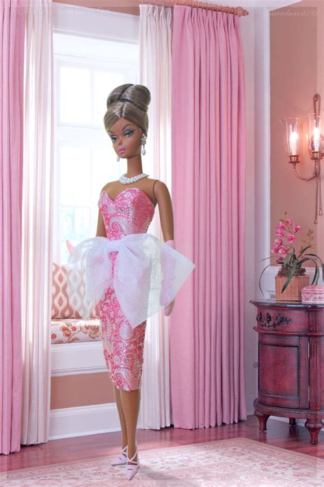 elegant in pink in this photo evening gown barbie® doll is wearing a pink silk brocade stra