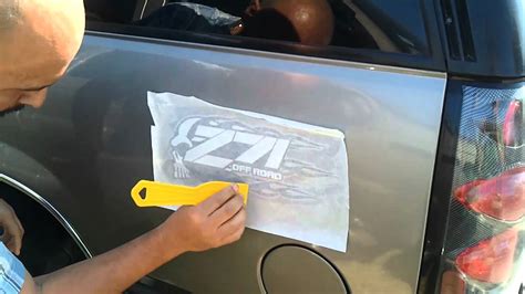 In a spray bottle, add 2 parts dish soap and 1 part rubbing alcohol. car decal sticker install - YouTube