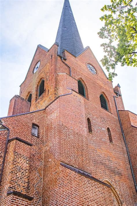 A Historic Red Brick Church Tower Against The Sky Stock Image Image