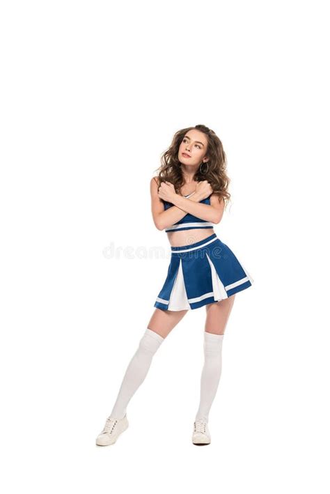 Dreamy Cheerleader Girl In Blue Uniform With Crossed Arms Looking Away