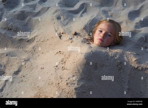 Girl Buried In The Sand At The Beach Stock Photo 118882439 Alamy