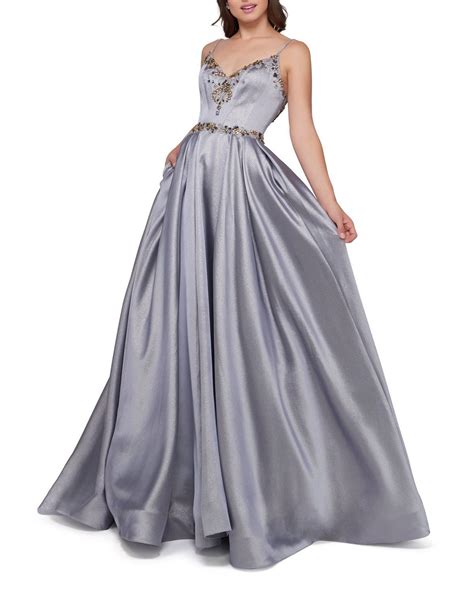 Mac duggal's romantic gown is designed with a mix of sparkling sequins and gorgeous lace throughout. Mac Duggal Platinum Metallic V-Neck Sleeveless Ball Gown w ...