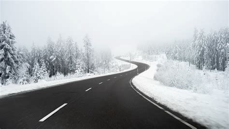 Road Between Snow Covered Forest Hd Winter Wallpapers Hd