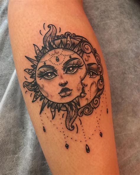 A Sun And Moon Tattoo On The Left Thigh With Drops Of Water Coming Out