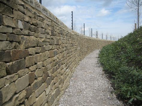 Curved Dry Stone Wall With Copings Dry Stone Wall Stone Cladding