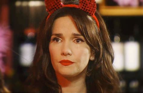 A Close Up Of A Person With A Red Bow On Her Head