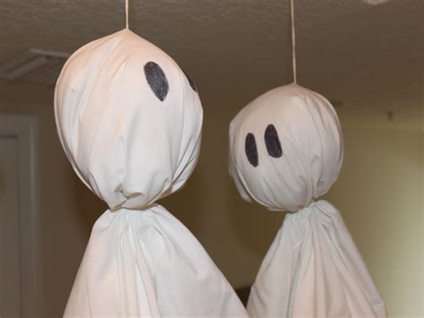 How To Make Halloween Flying Ghosts From An Upcycled Sheet Inhabitots