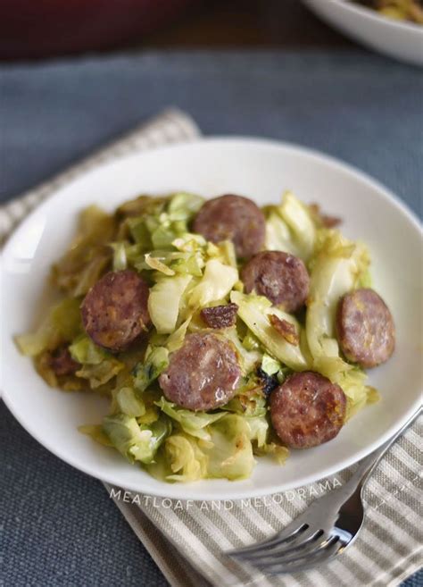 Toss to mix all ingredients together and coat the cabbage with butter and seasonings. fried kielbasa and cabbage with onions and bacon on white plate | Kielbasa and cabbage, Kielbasa ...